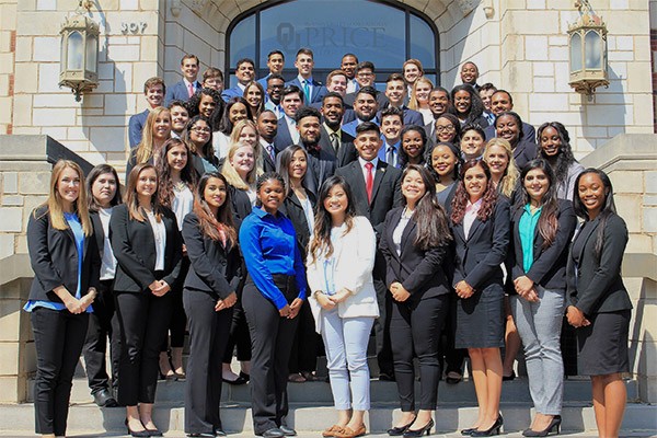 members of the multicultural business program pose outside of Adams Hall at the Norman campus.