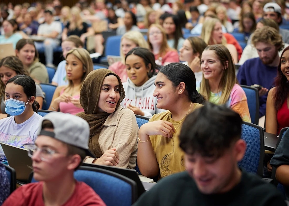 Students sitting lecture style class