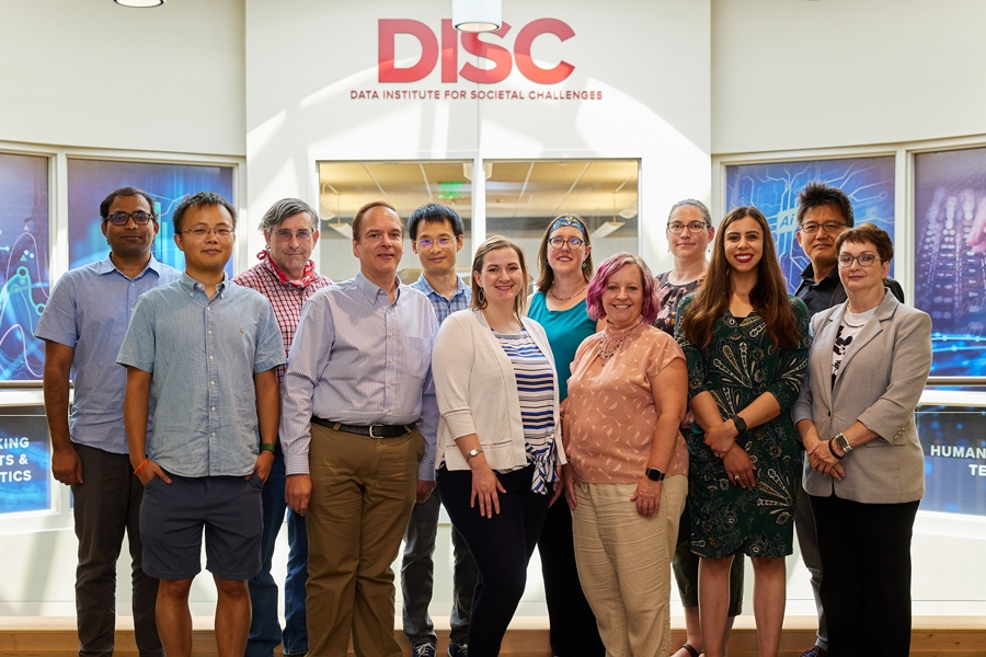 disc team standing outside offices