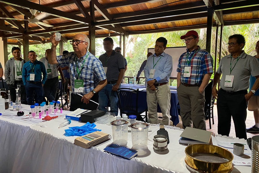 Julio Alegre, Ph.D., a professor at UNALM and the Peruvian coordinator of the soils and crops team, demonstrates a soil analysis kit.