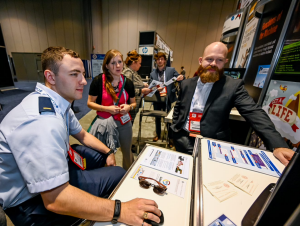 Emmett Mathews, art director of the K20 Center’s Game-Based Learning team, demos “Get a Life” at the Serious Games Showcase and Challenge, held in Orlando earlier this month. 
