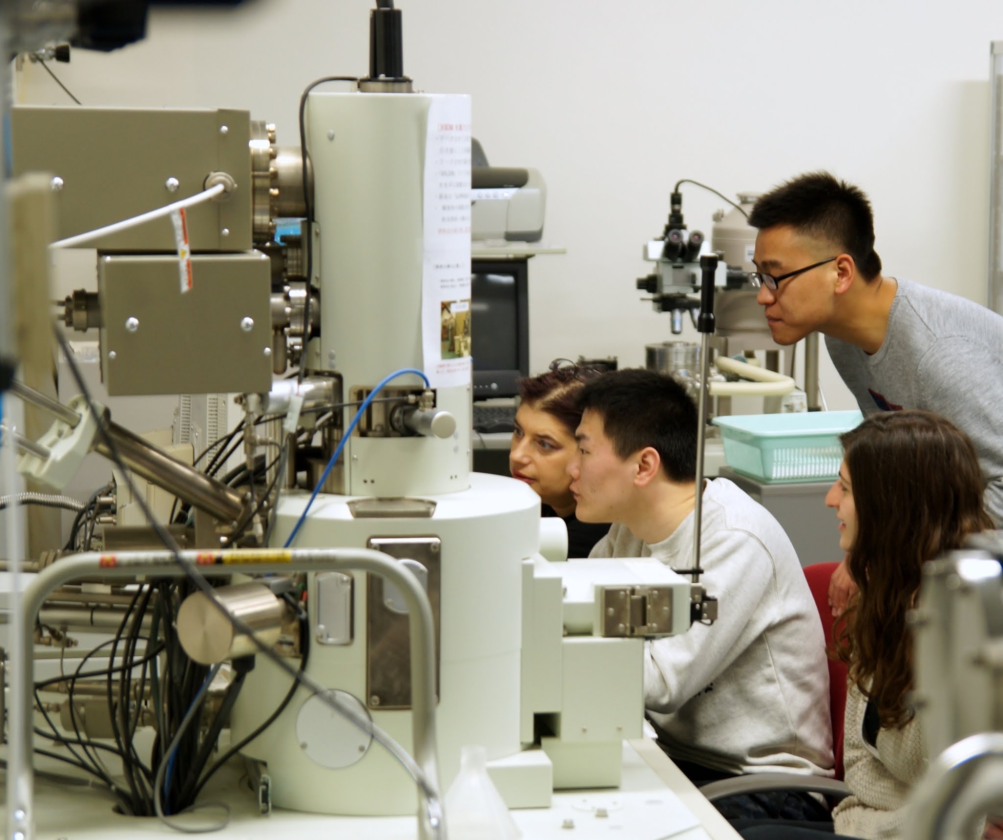 Professor Furis (left) with a University of Vermont undergraduate student (right) working at the Scanning Electron Microscopy facility at Yamagata University with graduate students from the Yoshida group in 2018.