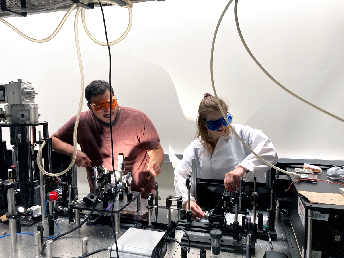 University of Oklahoma graduate student, Sergio Chacon, helping undergraduate researcher Rachel Penner set up perovskite solar cell measurements. 