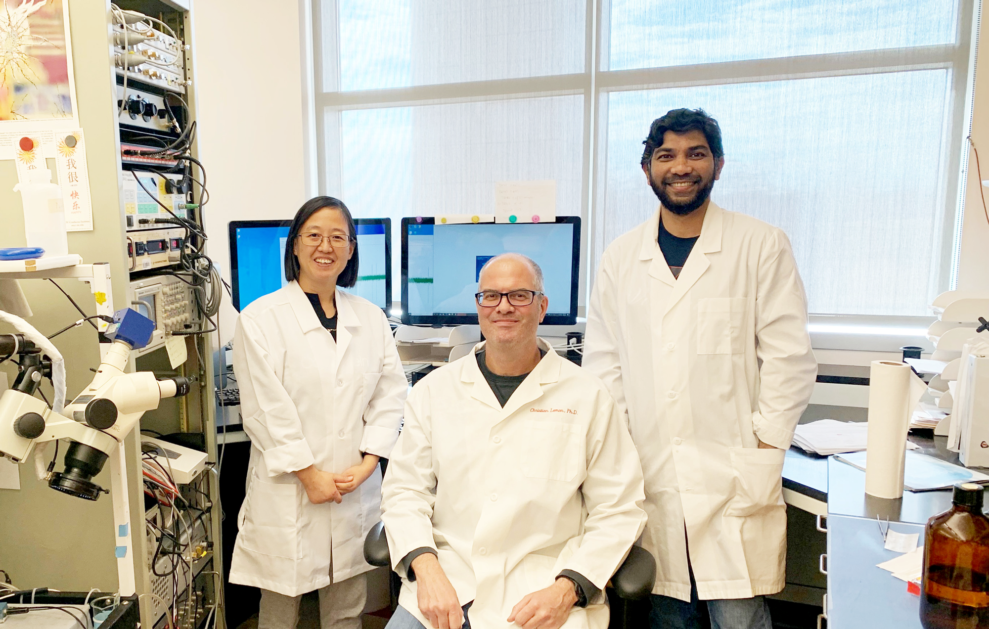 Associate Professor Christian H. Lemon, Ph.D. (center) with Jinrong Li, Ph.D. (left) Md Sams Sazzad Ali (right) in Lemon’s lab at the University of Oklahoma. 