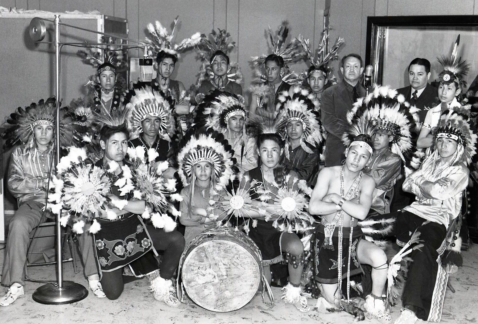 Pawnee Indian School students as guests of the Indians for Indians radio show. Western History Collections, OU Photographic Service Collection, no. 16344.