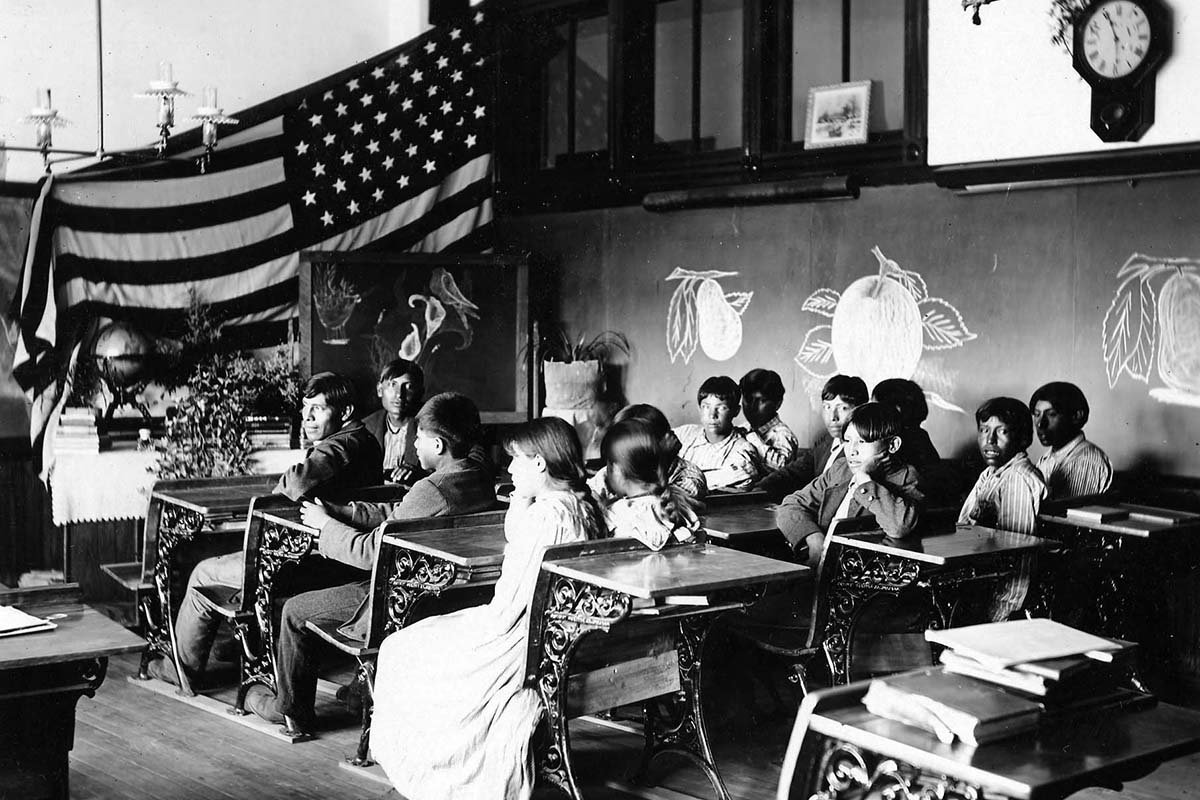 Image #357 from the Frank Phillips photograph collection, and is described as “A classroom scene at Riverside Indian School. Anadarko, O.T. 1901.