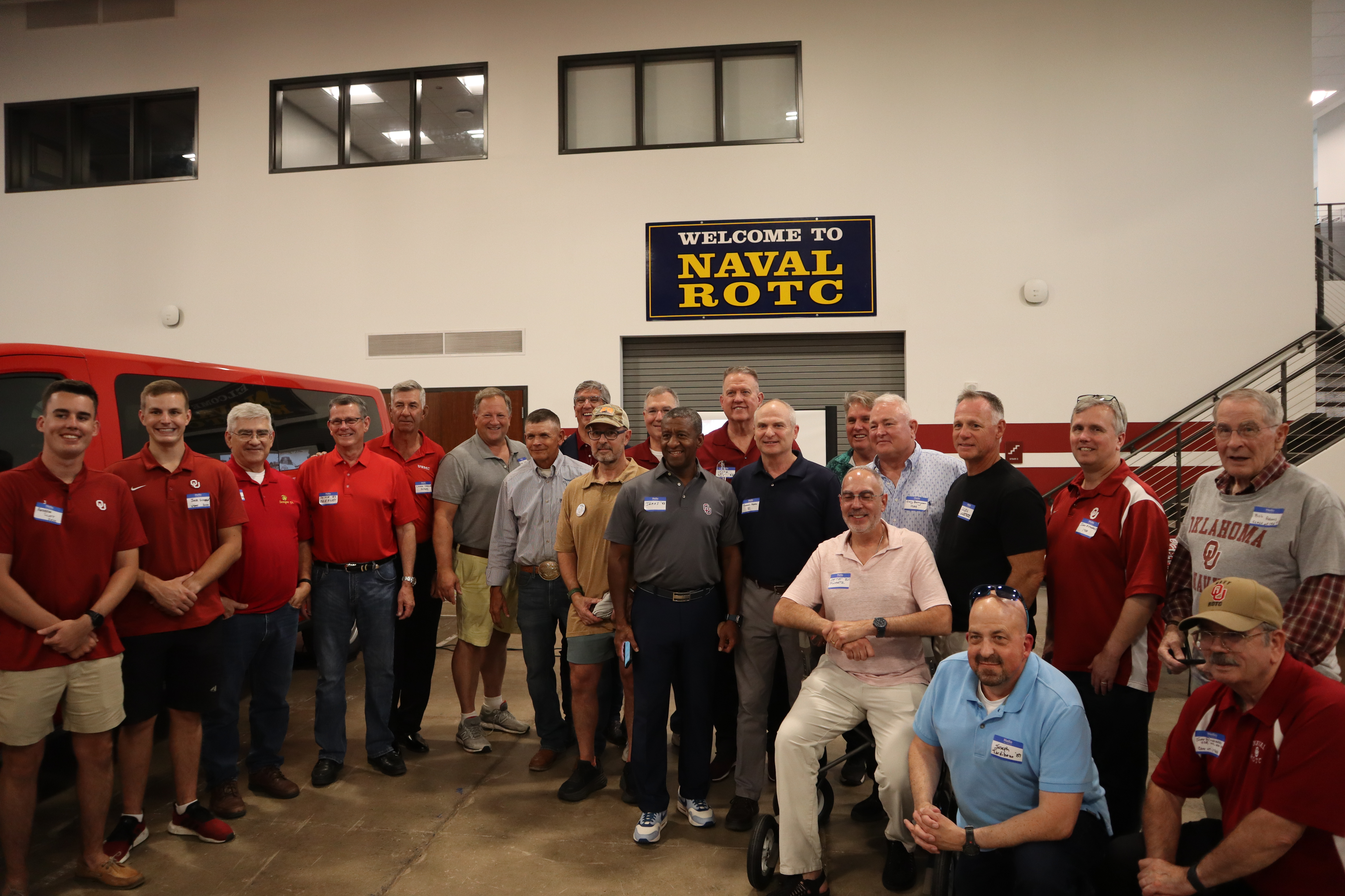 Group of NROTC members inside at a welcome event.