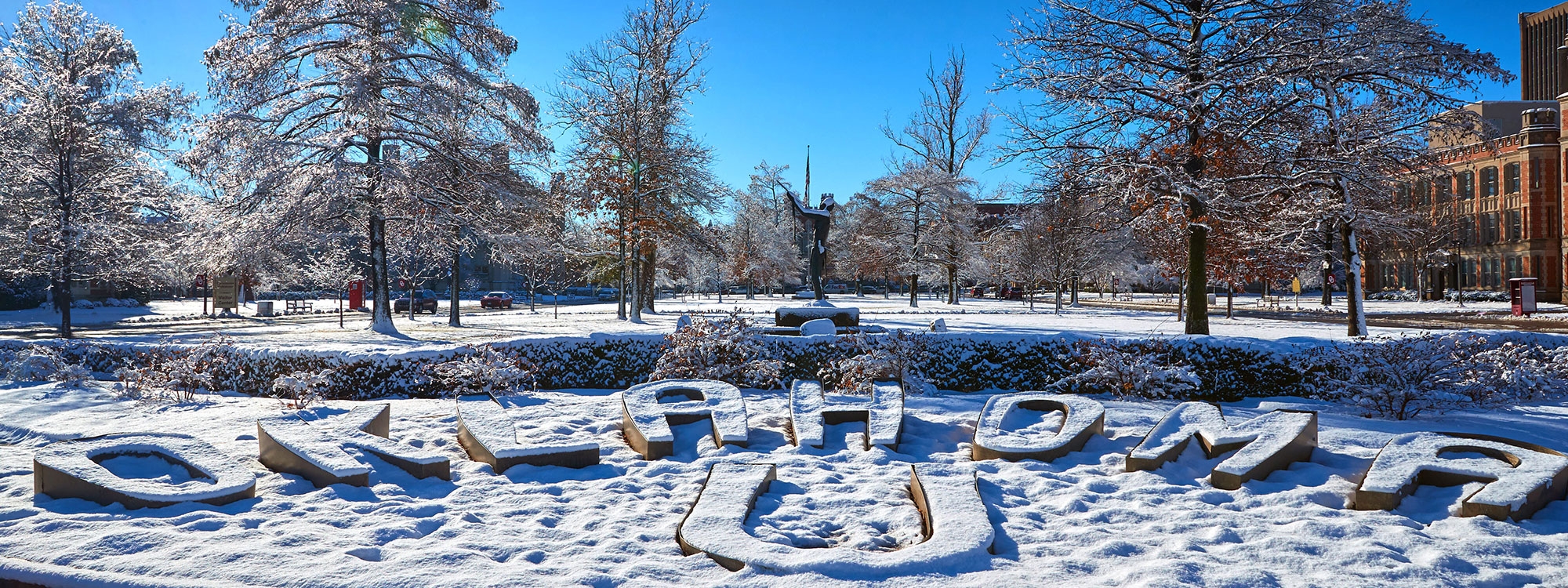 Oklahoma U letters covered in snow on the North Oval.