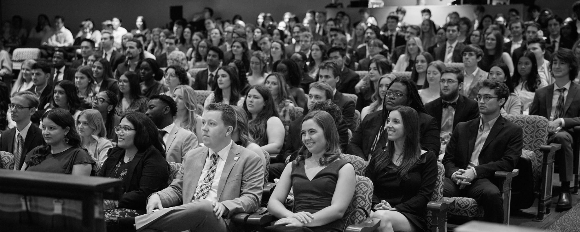 A black and white photo of student recipients seated in Holmberg Hall for the Campus Awards Program.