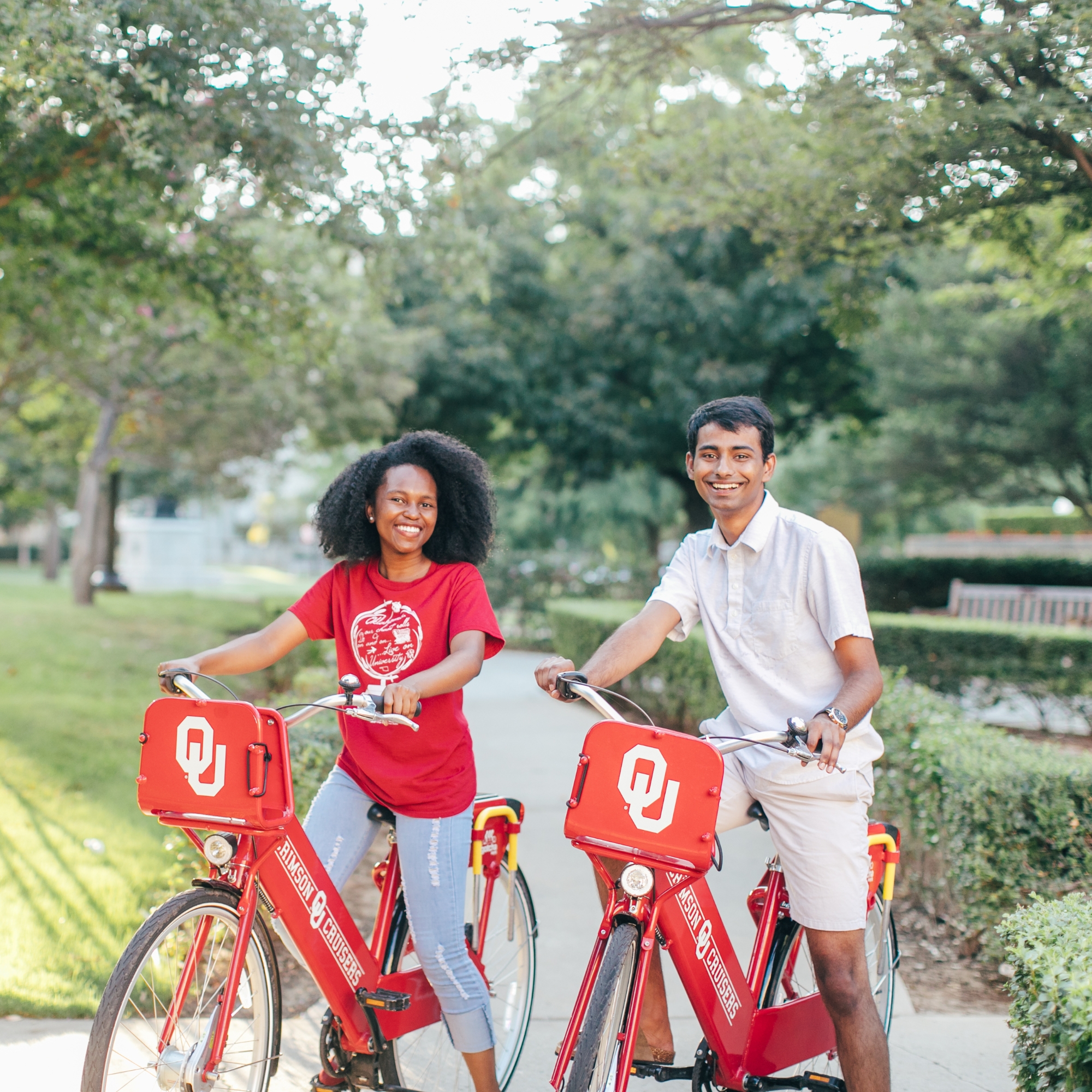 Students ride bikes with OU logo