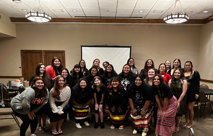 Gamma Delta Pi members pose for a group photo. 