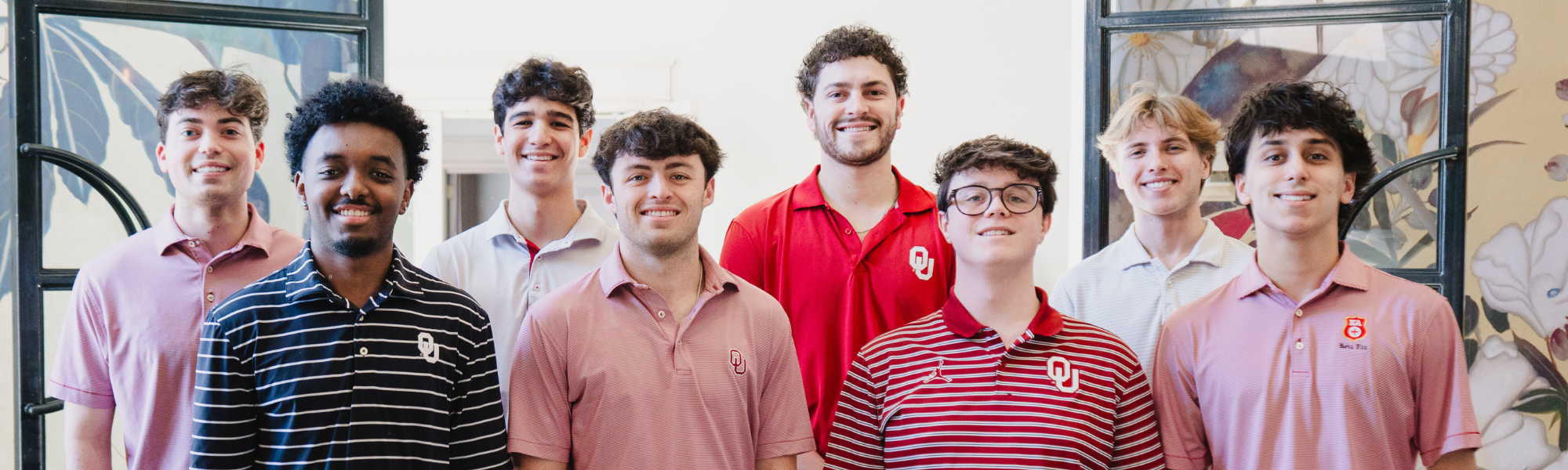 Photo of IFC Executive Team members in front of Evans Hall. 