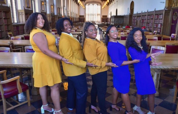Sigma Gamma Rho members pose for a group photo.