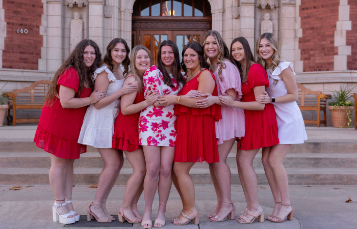 Alpha Omicron Pi members pose for a group photo.