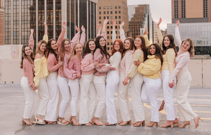 Alpha Gamma Delta members posing for a group photo.