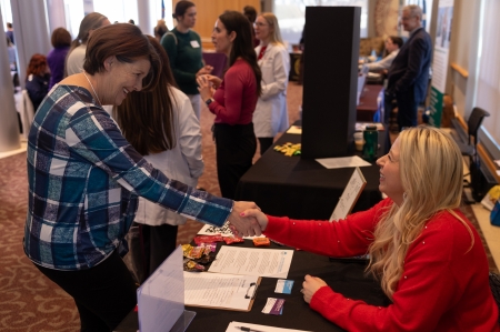 Katrina Gratton meets with an agency representative at the OU-Tulsa Social Work Practicum and Job Fair.