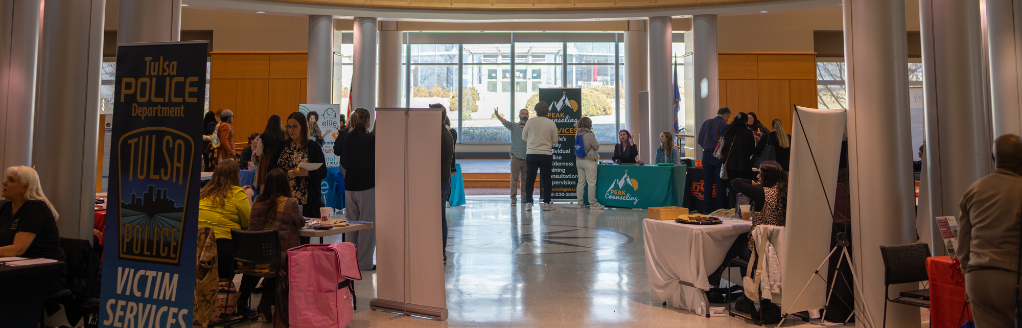 Multiple tables set up at the OU-Tulsa Social Work Practicum and Job Fair.