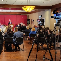 OU President Joe Harroz speaks at OU-Tulsa Founders Student Center while cameras look on