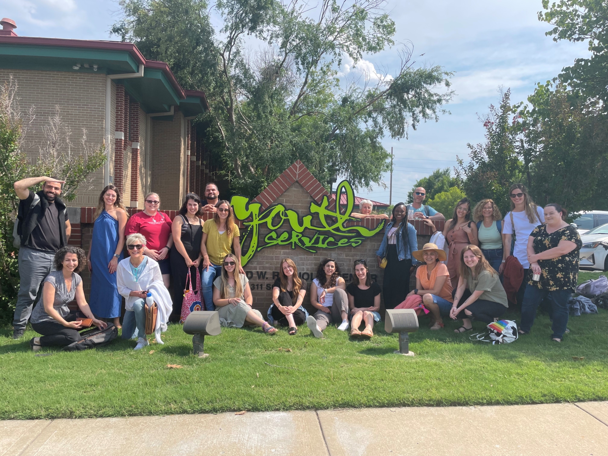 Social work exchange program participants visiting Youth Services of Tulsa