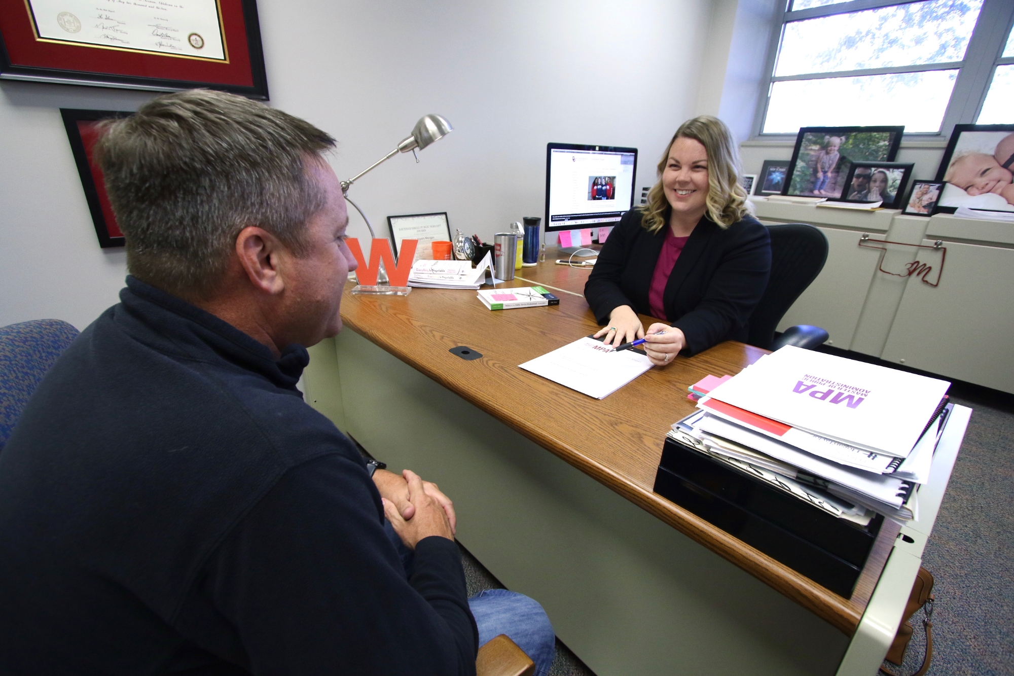 MPA professor talking to student