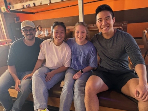 Four students hanging out together at a retreat.