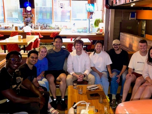 A group of students out at a restaurant together.