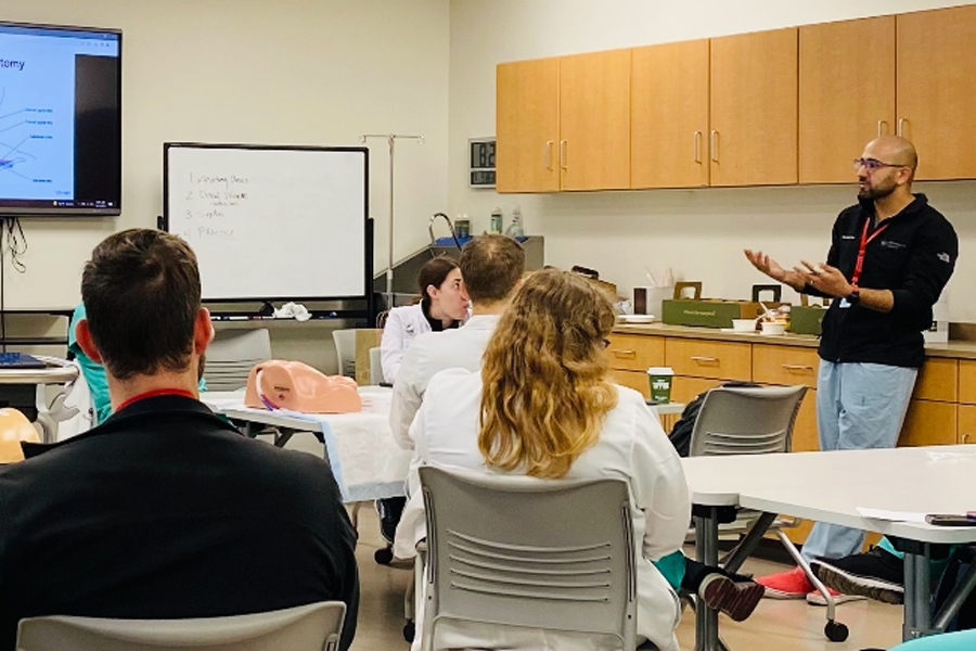 Teacher instructing a class of medical students.