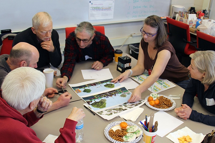 Students and faculty work on a design plan in the Urban Design studio