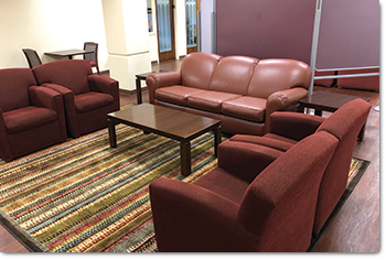 conoco wing lounge space; couch and armchairs