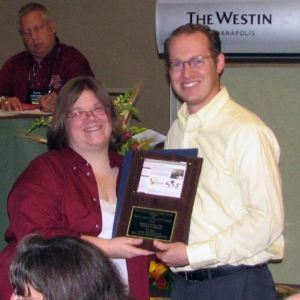 Mark Walvoord accepts the Learning Center Website Excellence Award for 2011 at the NCLCA Annual Conference in Indianapolis, IN