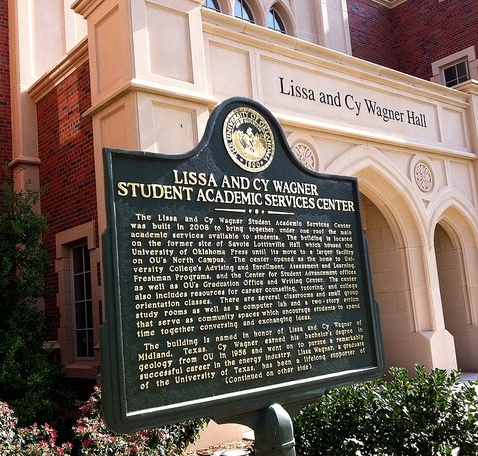 Lissa and Cy Wagner Hall with sign