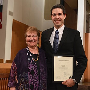 Adam Pajan of Monroeville, Pa., who is pursuing a doctor of musical arts degree in organ with church music emphasis at the University of Oklahoma, poses with Frances Nobert, president of the Board of Directors of the Mader Foundation.