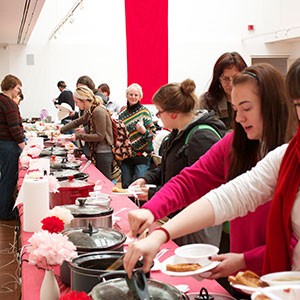  Visitors fill their plates and bowls with grilled cheese sandwiches and homemade soups at the OU School of Art & Art History’s Second Annual Art from the Heart in 2012.