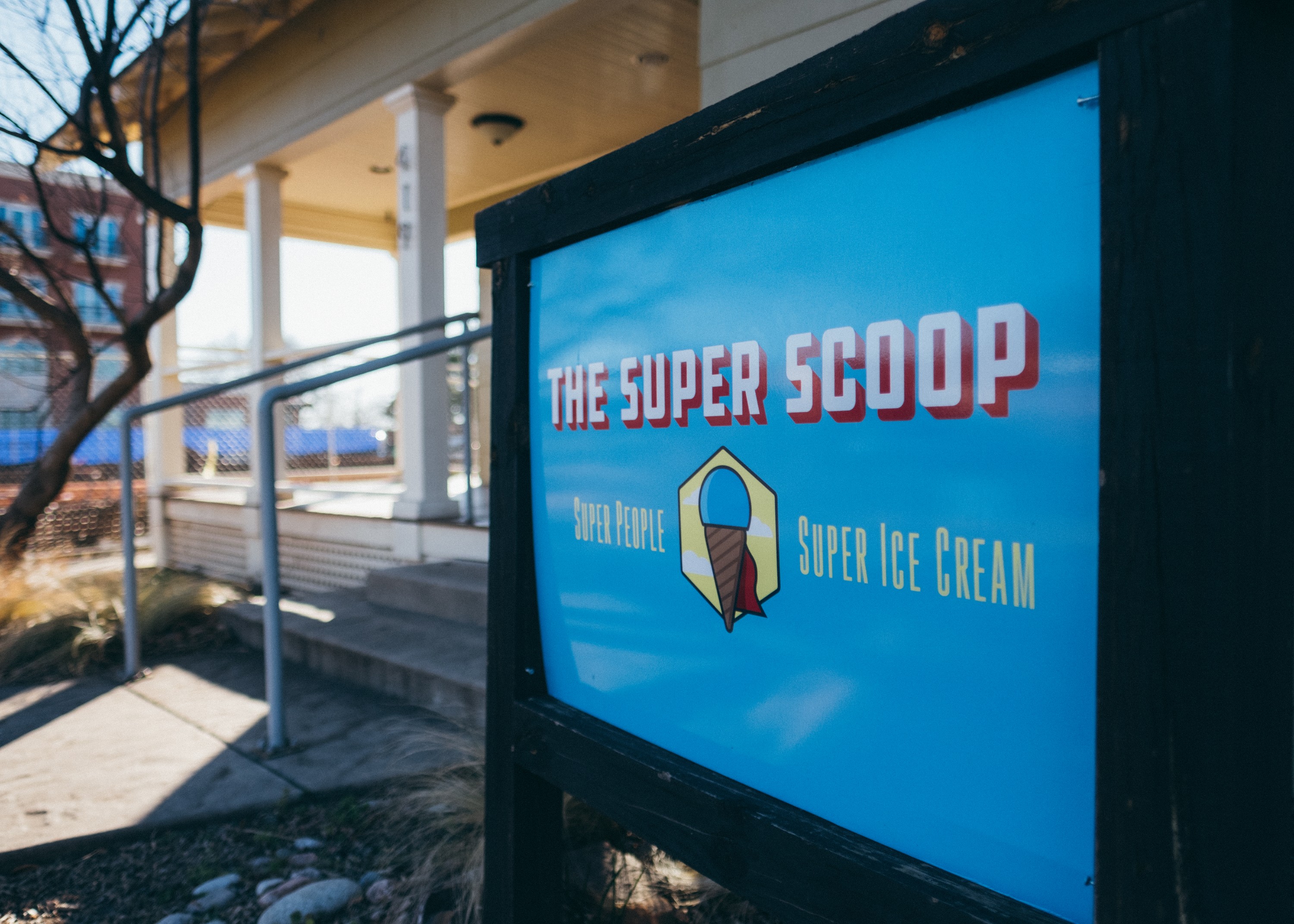 The Super Scoop's big blue sign in front of the store