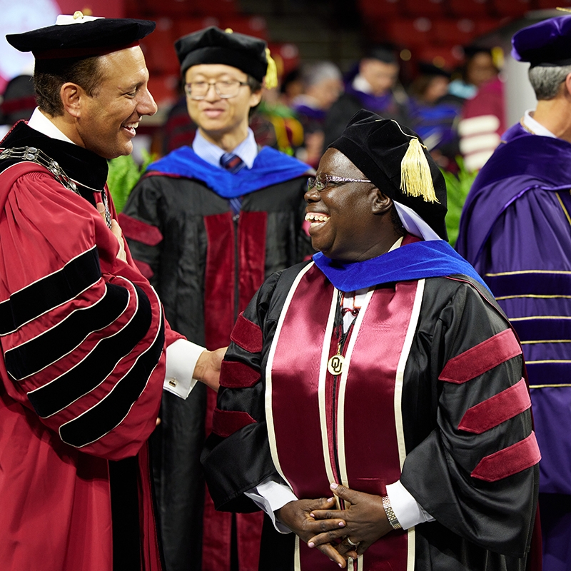 OU President Joseph Harroz Jr. congratulates Sister Rosemary Nyirumbe after she receives her doctoral degree.