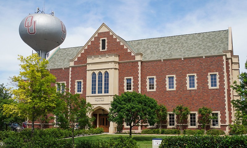 Exterior view of Wagner Hall from the Asp Ave side. Image includes silver OU water tower.